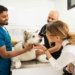 A pet owner with his dog at Noble Veterinary Clinics for a consultation