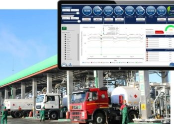 A Sicuro Technology fleet management dashboard displaying fuel efficiency, mileage, driver behavior scores, and real-time vehicle analytics over an industrial fuel terminal.