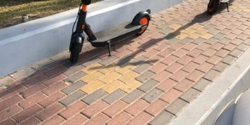 Electric kick scooters parked on a pavement in Abu Dhabi in February 2020