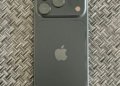 Actual black Apple iPhone 18 Pro photographed from the rear in September 2026, showing triple-camera module