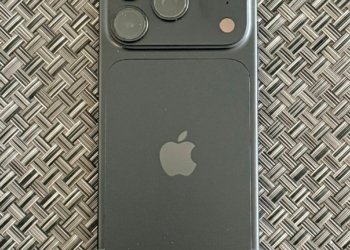 Actual black Apple iPhone 18 Pro photographed from the rear in September 2026, showing triple-camera module
