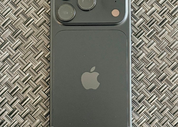Actual black Apple iPhone 18 Pro photographed from the rear in September 2026, showing triple-camera module