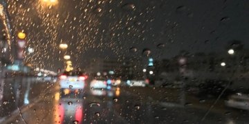 Archive photograph of rain on a Dubai road at night