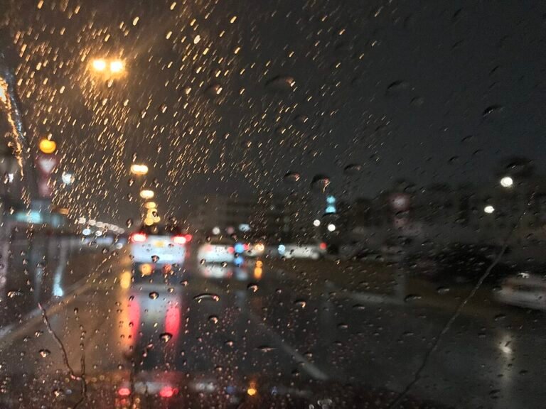 Archive photograph of rain on a Dubai road at night
