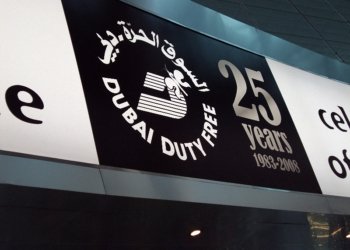 Archival advertising signage at Dubai International Airport, illustrating advertising content design