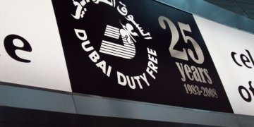 Archival advertising signage at Dubai International Airport, illustrating advertising content design