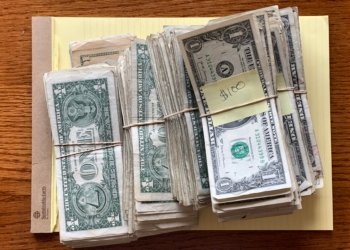Illustrative photograph of bundles of United States dollar banknotes taken in 2020