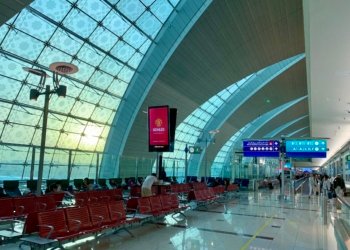 Passenger waiting area inside Dubai International Airport, illustrating UAE family visit visa travel