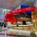 Travelers inside Dubai International Airport terminal concourse, illustrating guidance for visa applicants