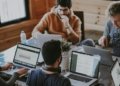 Illustrative image of people collaborating in an office, representing the US labor market