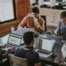 Illustrative image of people collaborating in an office, representing the US labor market