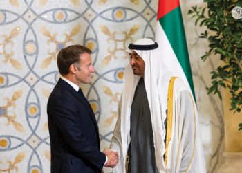 Sheikh Mohamed bin Zayed shaking hands with Emmanuel Macron during the official UAE visit