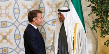 Sheikh Mohamed bin Zayed shaking hands with Emmanuel Macron during the official UAE visit